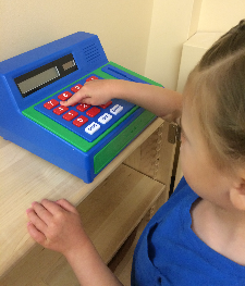 Child playing with cash register